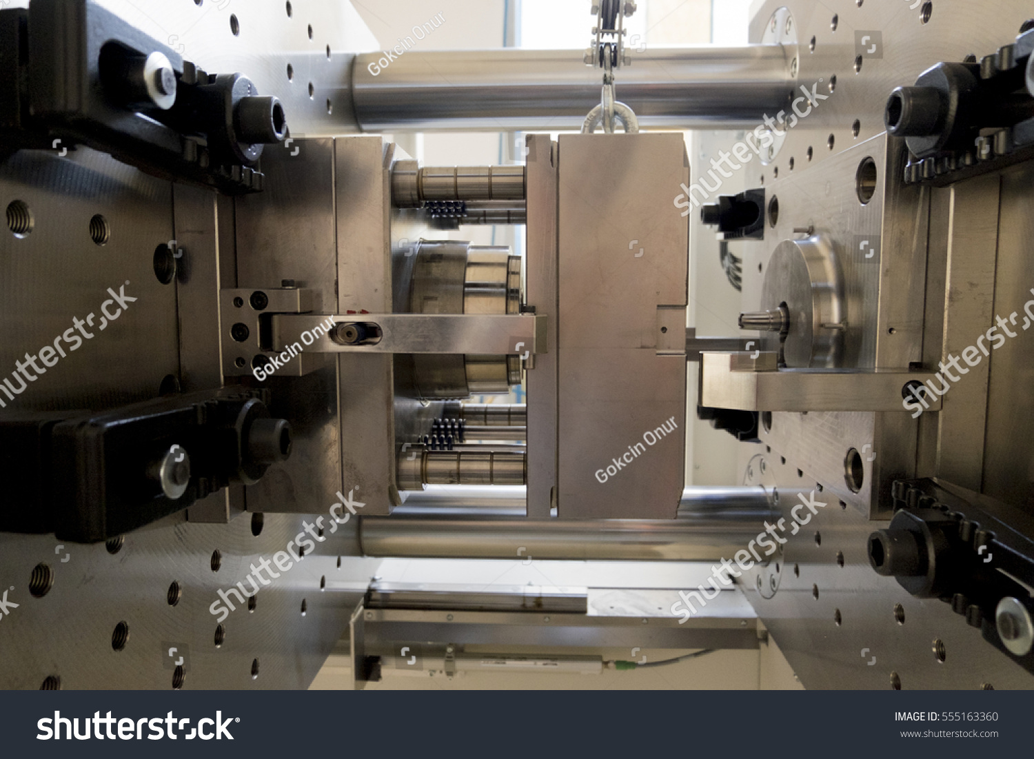stock-photo-a-part-of-an-injection-moulding-machine-555163360